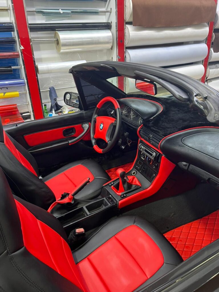 Interior view of a BMW Z4 M Coupe showcasing luxurious car upholstery and modern design elements.