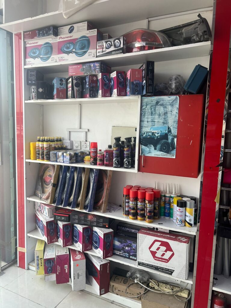 A shelf where various car accessories are displayed for customers to see.