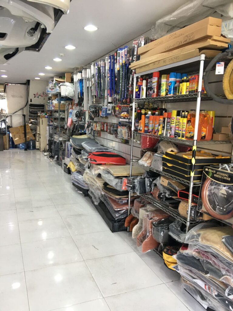 A well-equipped car accessories shop, AlBadiya Car Accessories & Upholstery, features numerous tools and supplies for vehicle maintenance